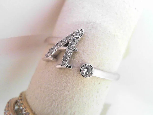 Ladies rings fierce radiance -10K WG AND DIAM RING, LETTER A