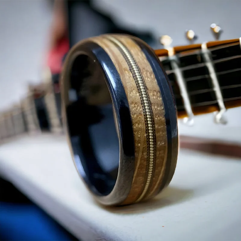 Ladies rings lead glow -“The Bluegrass Guitar Player”  Kentucky Bourbon Whiskey Barrel Black Ceramic Ring With Guitar String